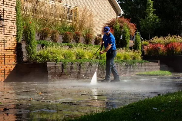 Power washing a concrete patio
