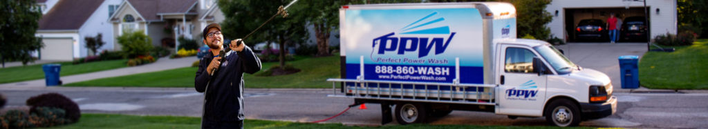 Perfect Power Wash Technician Washing a House