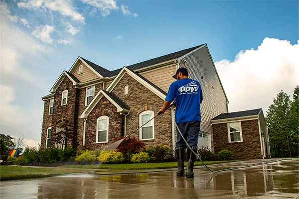 Perfect Power Wash employee sealing concrete