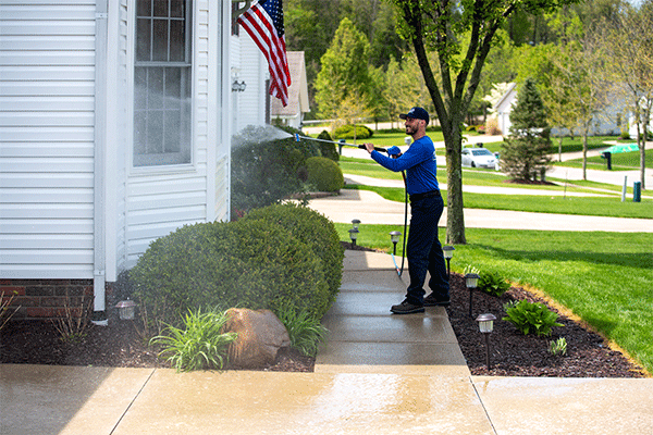Perfect Power Wash employee soft washing siding